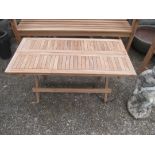 A folding teak garden coffee table