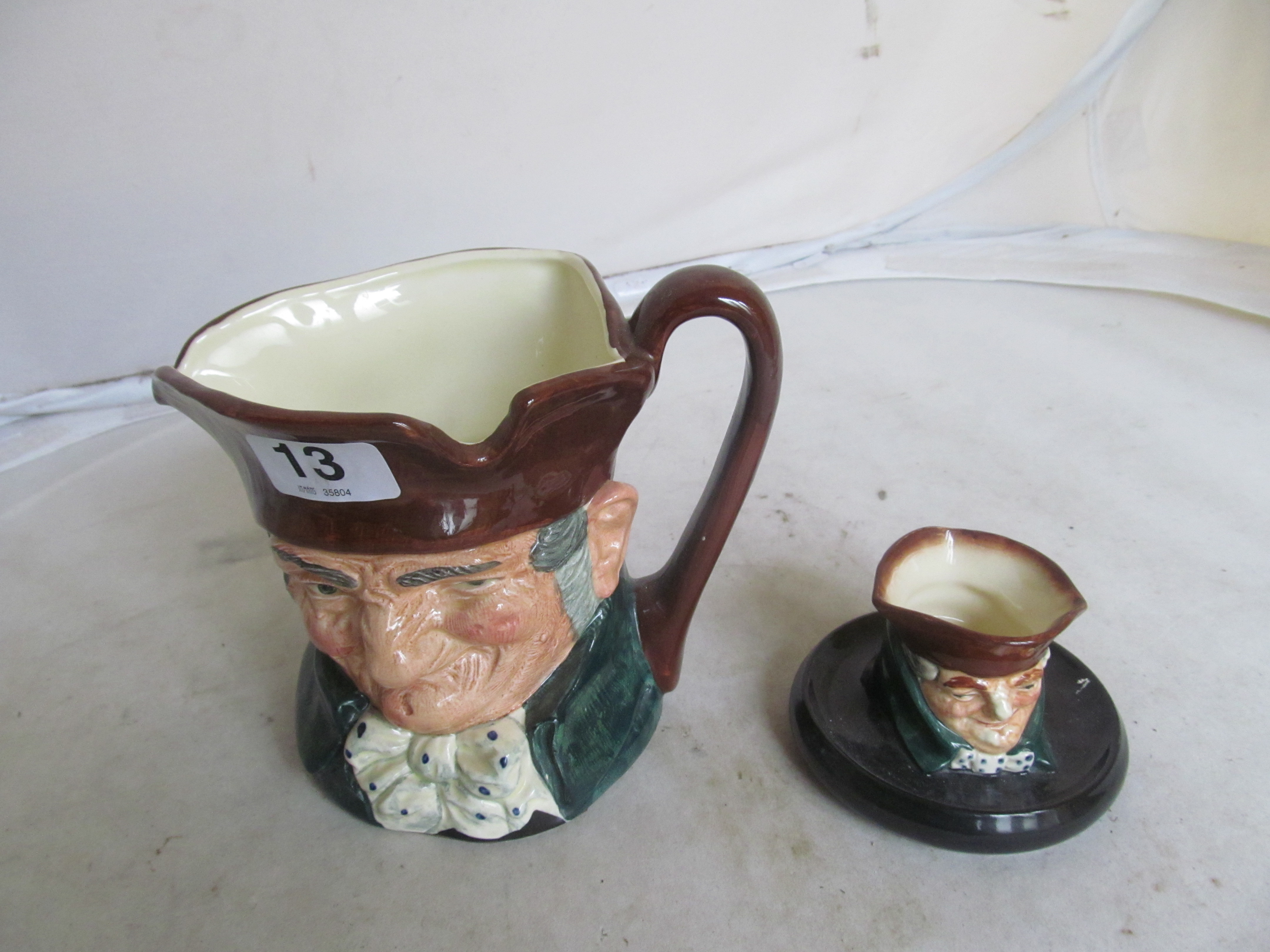 A Doulton character jug Old Charlie and Old Charlie on stand