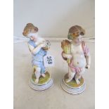 A pair of porcelain figures cherubs spring and autumn (1 a/f) on circular bases and a Coalport plate