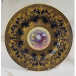 A Royal Worcester plate blue and gilt with central plums and berries signed Higgins