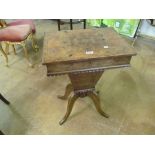 A 19th Century walnut sewing table on cabriole legs