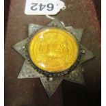 A gilt medal from The Ancient Order of Foresters mounted in Victorian silver eight pointed star