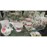 Twelve Royal Worcester ironstone jugs and shelf unit with centigrade