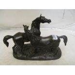A bronze group of two horses