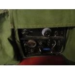 A Military radio in canvas case and safety cooker