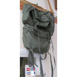 A large green 'Outbound' travel rucksack