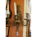 A three branch gilt arrow and holder wall light