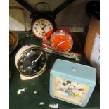 A Mickey Mouse Ingersoll clock and other vintage clocks