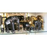 A brass bulldog, other brass and ebony elephants