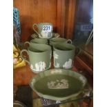 A Wedgwood green Jasperware coffee set six saucers, five cups and fish