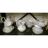 A French porcelain teaset with blue and gilt edge and gilt handles