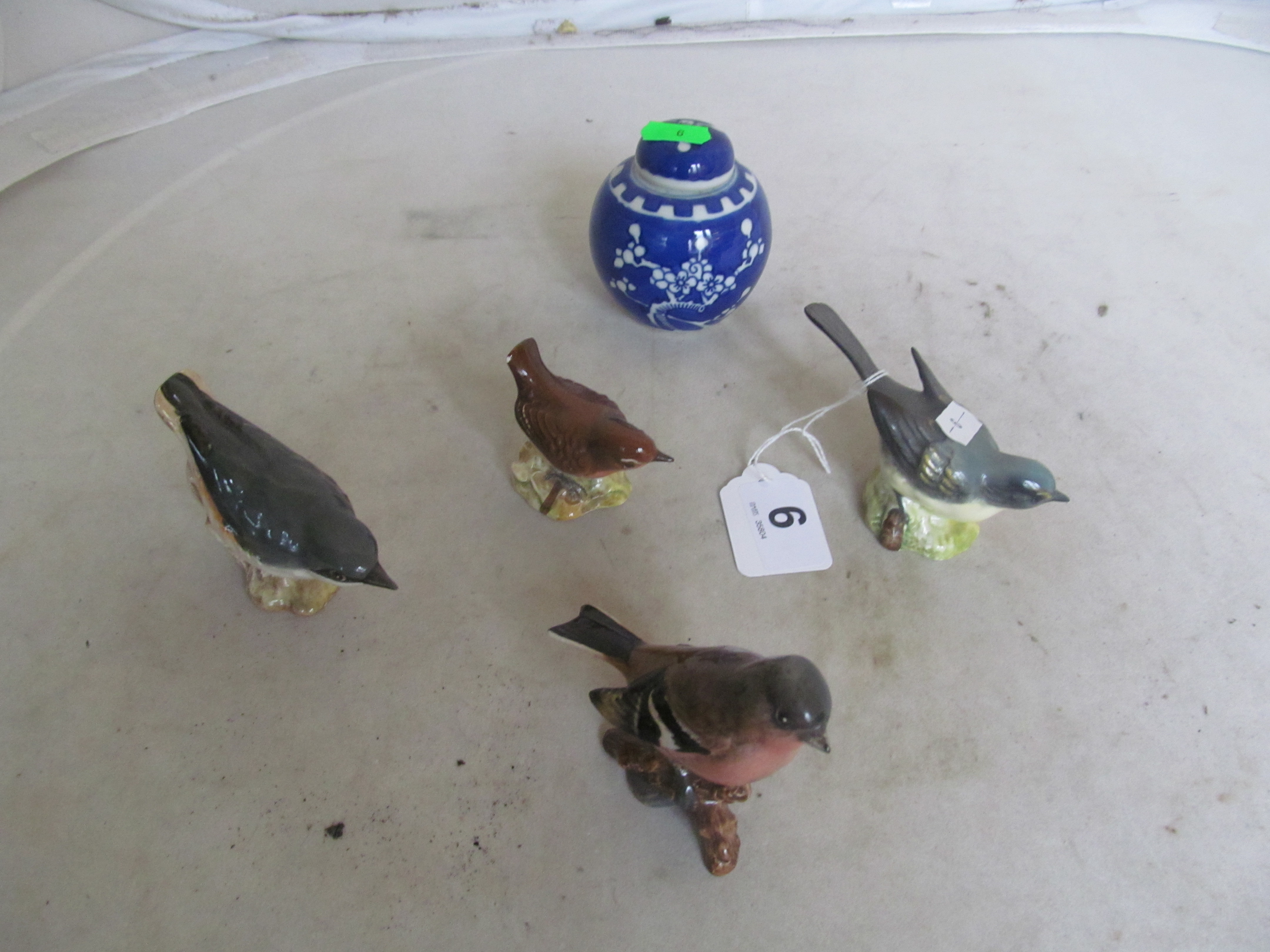 Four Beswick birds and a small ginger jar