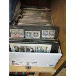 A large quantity of whole world stamps on cards