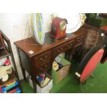 A narrow side table with drawers and leather inset top