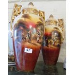 A pair of large two handled Edwardian lidded vases country scenes.