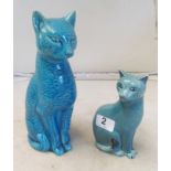 A turquoise glazed Poole Pottery cat and a another turquoise pottery cat