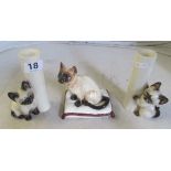 A pair of Siamese kitten candleholders and a Siamese cat on cushion