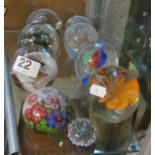 Nine small paperweights.