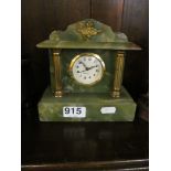 A small onyx mantel clock