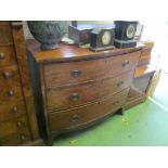 A Regency mahogany bow front chest of three graduated long drawers on swept bracket feet