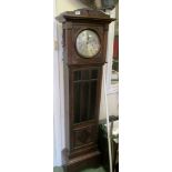 An oak longcase clock.