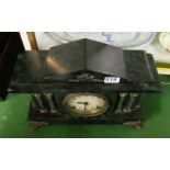 A marble effect architectural mantel clock