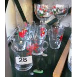 Three Christmas decoration wine glasses and some smaller Christmas decoration glasses