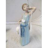 A Lladro figure girl with a hat