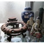 Two oriental figures, ginger jar and stands.