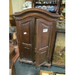 A mahogany two door cabinet with glass shelves