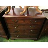 A George III mahogany chest fitted slide and four graduated long drawers with brass loop handles