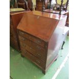 A small George III mahogany bureau, blind fret design to interior, four drawers on bracket feet