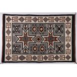 A NAVAJO FOUR CORNERS RUG