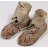A PAIR OF PLAINS BEADED MOCCASINS, CIRCA 1900