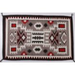 A CLASSIC NAVAJO STORM PATTERN RUG