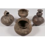 A COLLECTION OF FOUR POTTERY VESSELS