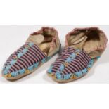 A PAIR OF PLAINS BEADED MOCCASINS, CIRCA 1890