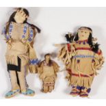 THREE BEADED HIDE DOLLS