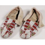 A PAIR OF PLAINS BEADED MOCCASINS, CIRCA 1910