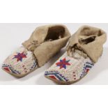 A PAIR OF PLAINS BEADED MOCCASINS, CIRCA 1910
