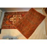 A North West Persian Woollen Rug With A Central Medallion within an all over design upon a cream,