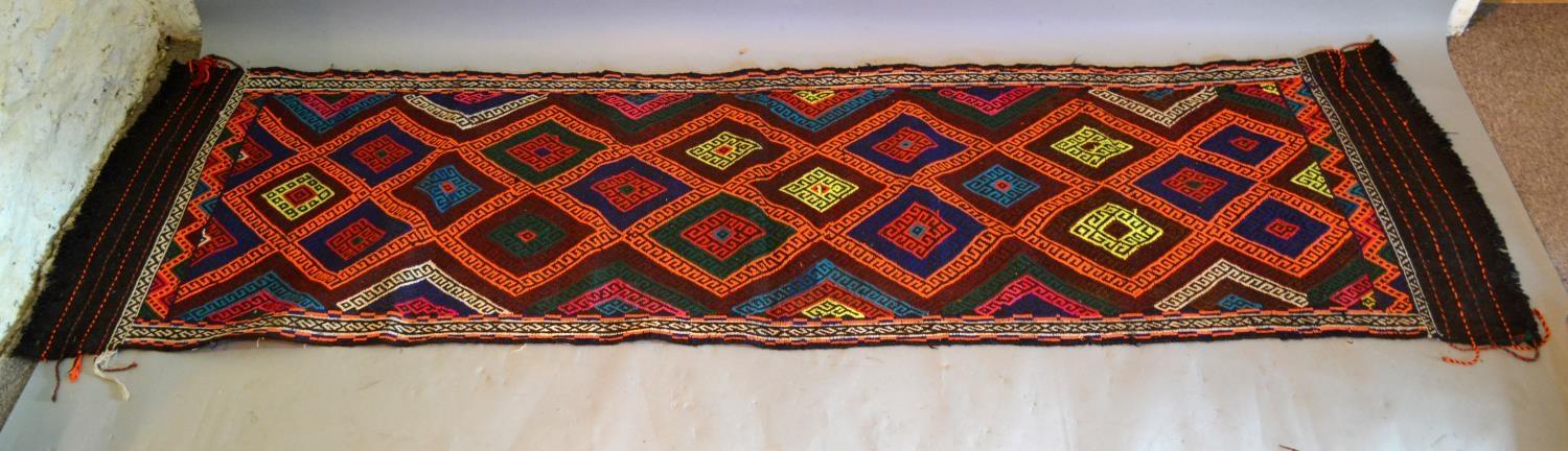 A Kilim Runner With An All Over Design Within Multiple Borders, 239cm by 62cm