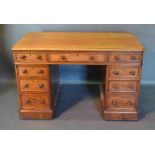 A Victorian Mahogany Twin Pedestal Desk By Maple & Co, the moulded top above an arrangement of