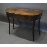 An Early 19th Century Mahogany Card Table, the hinged top above a plain frieze, raised upon inlaid