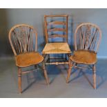 An 18th Century Elm Ladder Back Side Chair, together with a pair of wheel back side chairs