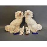 A Pair Of Staffordshire Models Of Spaniels, together with various other similar Staffordshire models