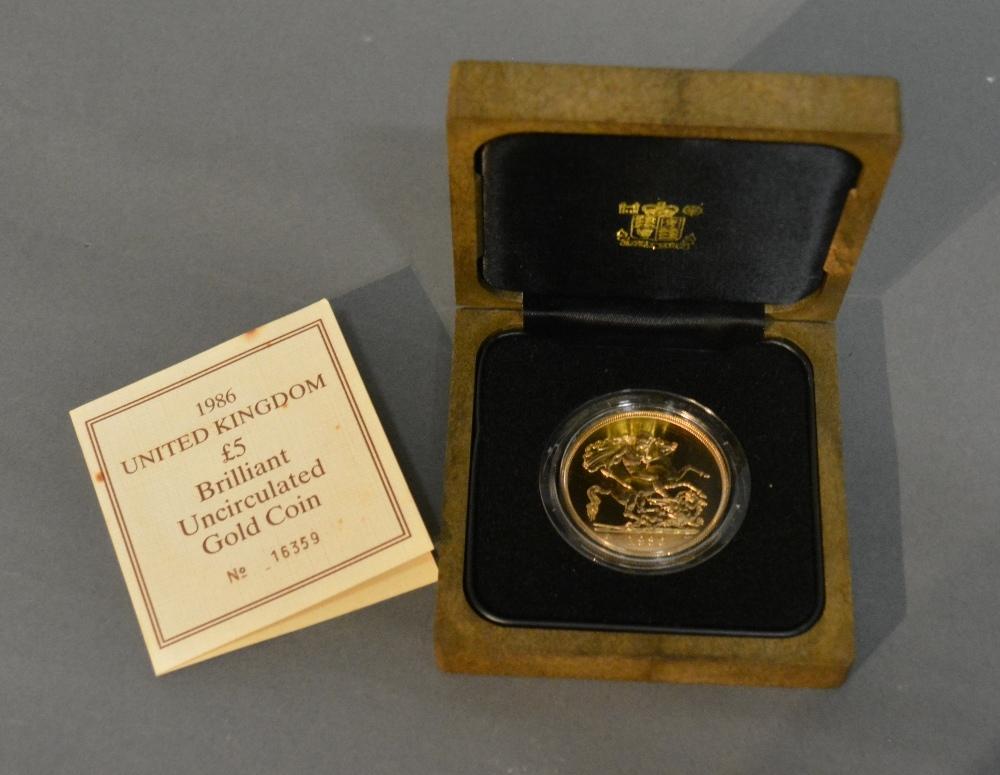 A 1986 United Kingdom Five Pounds Brilliant Uncirculated Gold Coin, 39.94g of 22ct gold within