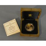 A 1986 United Kingdom Five Pounds Brilliant Uncirculated Gold Coin, 39.94g of 22ct gold within