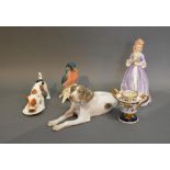 A Danish B & G Porcelain Model In The Form Of A Dog, together with a Royal Doulton model of a dog, a