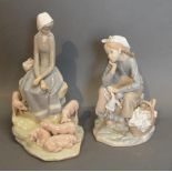 A Lladro Porcelain Model Of A Girl With Pigs, together with another similar Lladro porcelain model